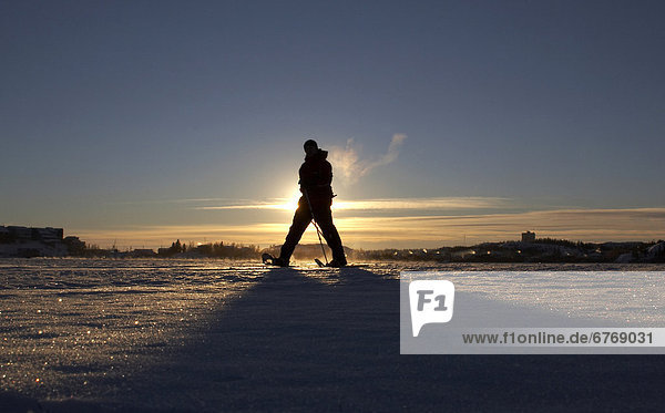 Snowshoeing the Back Bay portion of Great Slave Lake in Yellowknife  Northwest Territories