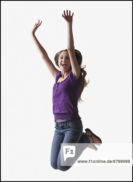 Teenage Girl jumping for joy