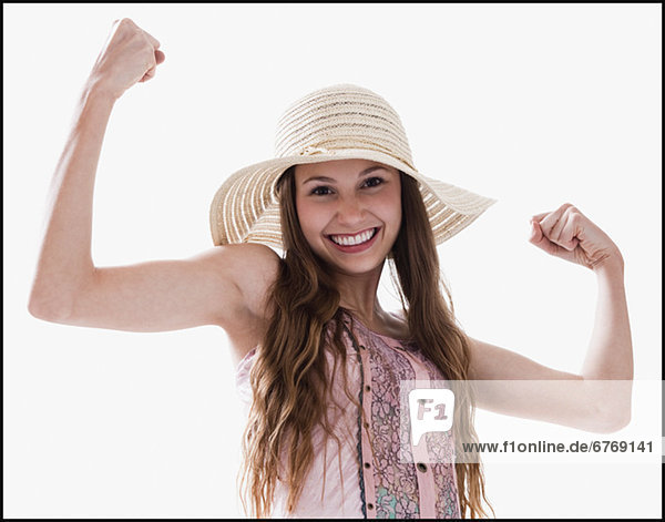 Smiling woman flexing her muscles
