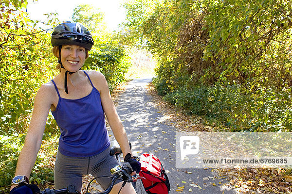 Woman on Bicycle Path  Toronto  Ontario