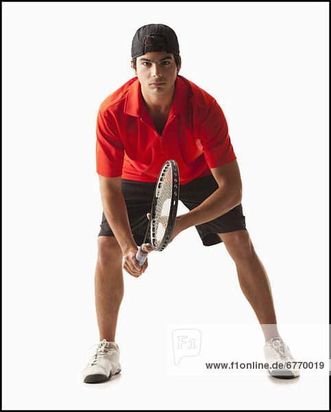 Junger Mann Tennisspielen