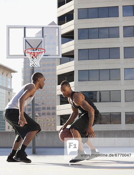 USA  Utah  Salt Lake City  two young men playing basketball