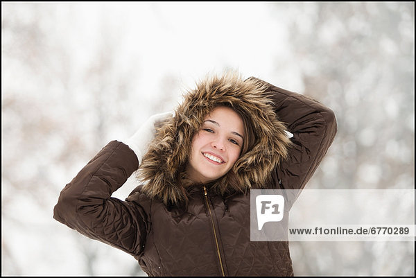 USA  Utah  Lehi  Portrait of young woman wearing winter coat outdoors