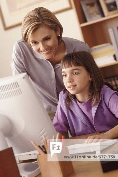 Mother and daughter in home office