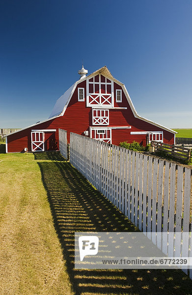 Red barn with fence  near Lake Alma  Saskatchewan