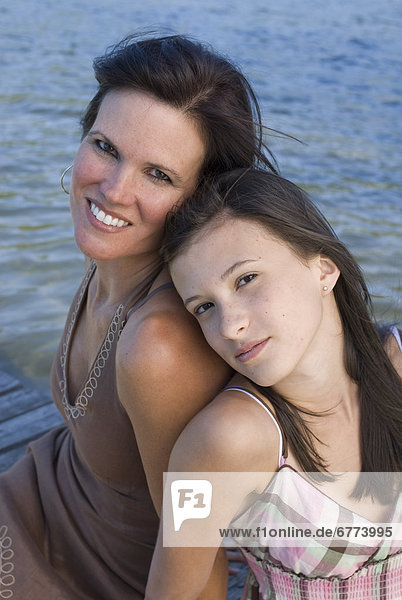 Portrait of a mother and daughter on a dock  Shawnigan Lake  Victoria  British Colombia