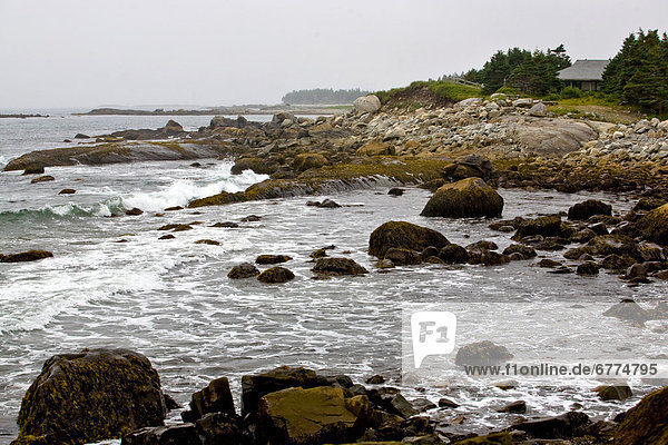 Cloudy sky and rocky shores of Tor Bay Provincial Park  Nova Scotia