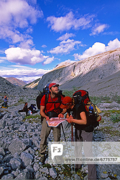 Hiker looking Confused after checking a Map  Mount MacDonald  Mayo  Yukon