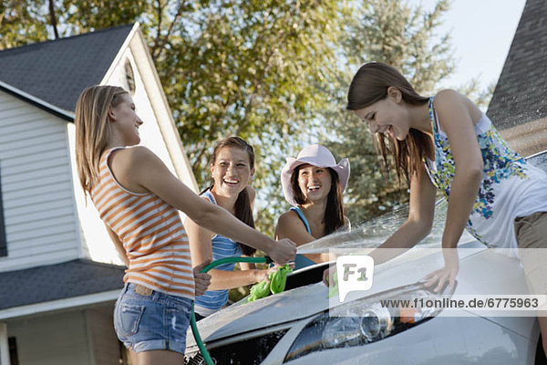 USA  Utah  Provo  Teenage girls (16-17) and young women watching car
