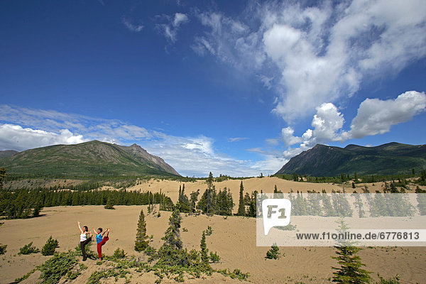 Women doing Yoga Outdoors  Carcross Desert  Yukon