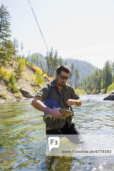 USA  Montana  Man fly fishing in North Fork of Blackfoot River
