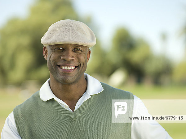 Smiling man on golf course