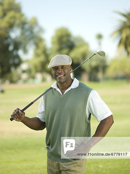 Mann  lächeln  halten  Golfsport  Golf  Verein  Kurs