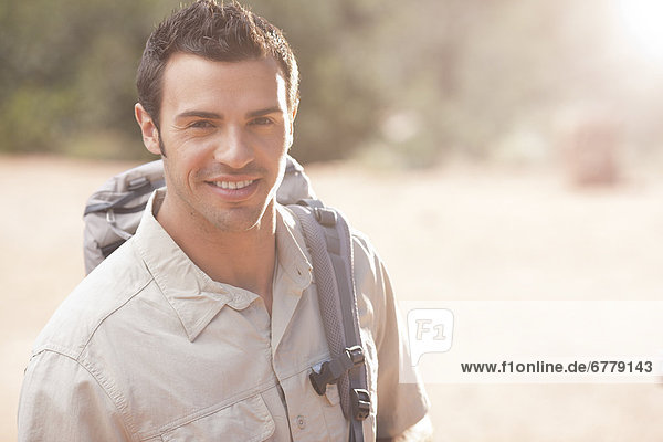 Young man hiking in desert