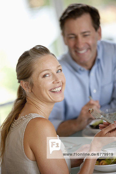 Mature couple eating meal