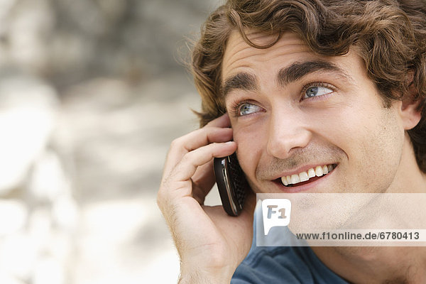 Portrait of young man talking on phone