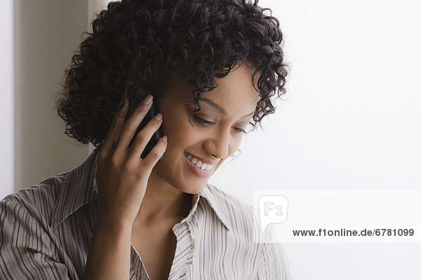Portrait of smiling businesswoman on phone