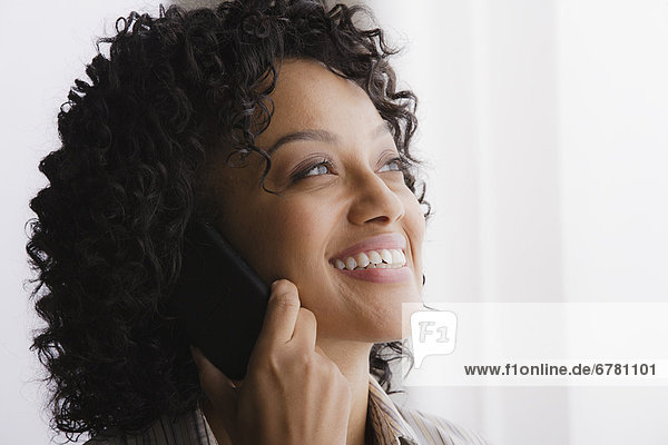 Portrait of smiling businesswoman on phone
