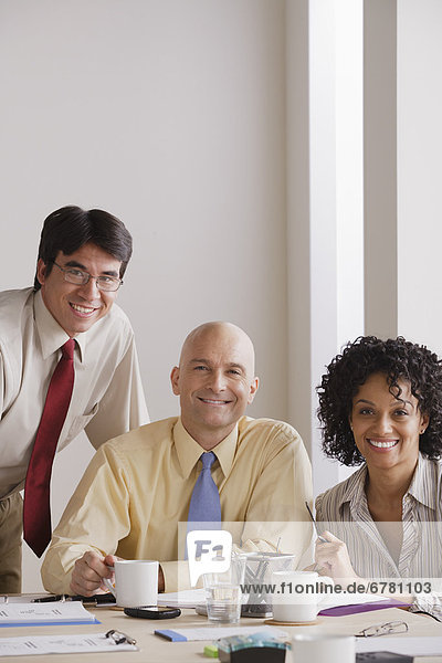Portrait of smiling business people at meeting