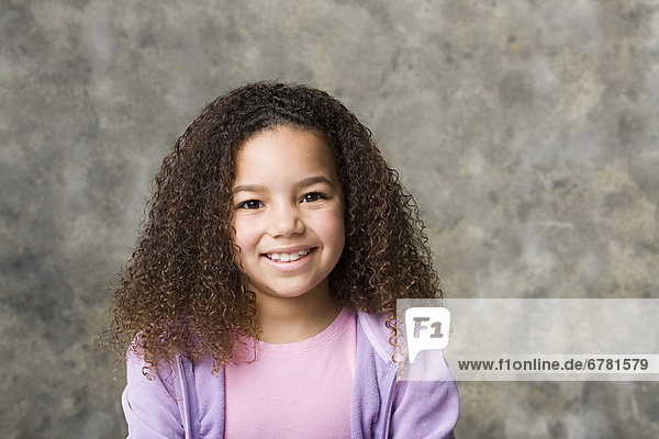 Portrait of smiling girl (8-9)  studio shot