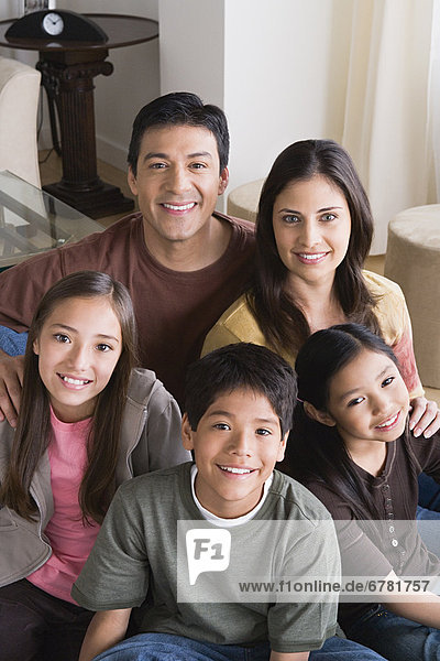Portrait of happy family with three children (8-9  10-11)