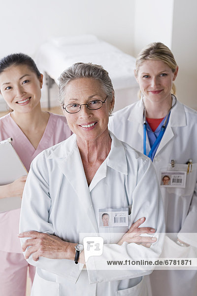 Portrait of three smiling female doctors