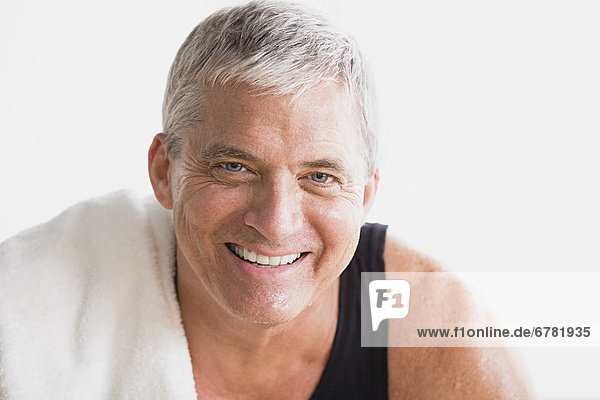 Portrait of smiling mature man in gym