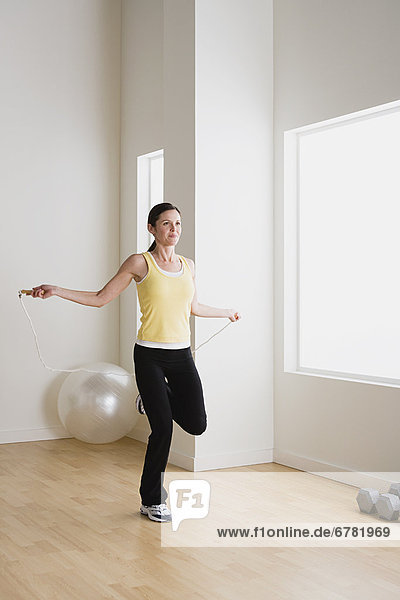 Woman exercising with jump rope