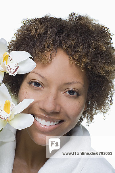 Portrait of attractive woman with tropical flowers