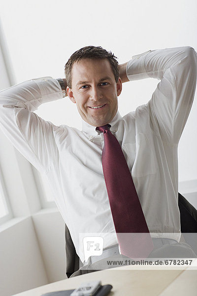Businessman relaxing in office