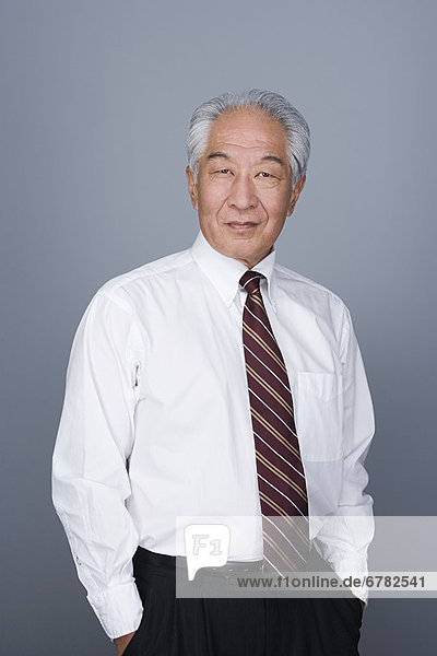Portrait of happy senior businessman