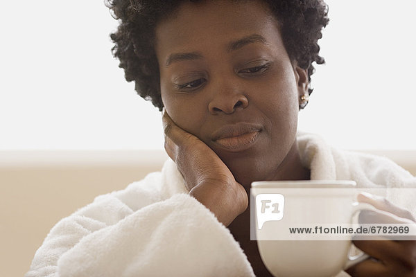 Woman enjoying Tasse Tee
