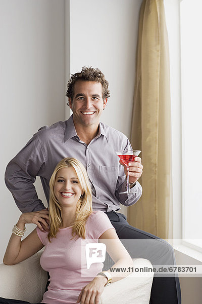 Portrait of smiling couple at home party