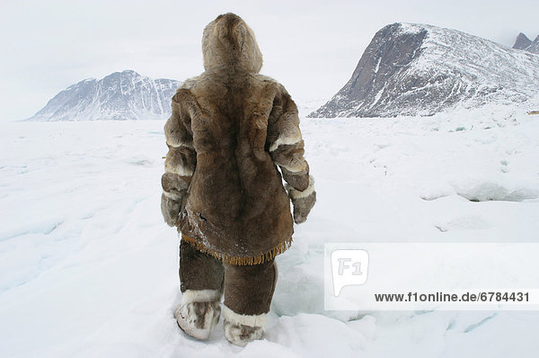 Person standing in a Caribou snowsuit  Grise Fiord  Nunavut