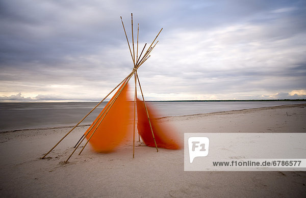 Tepee cover blowing in wind  Grand Beach  Manitoba