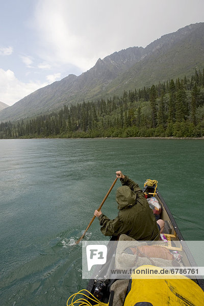Canoeing in the rain  Kusawa Lake Territorial Park  Yukon