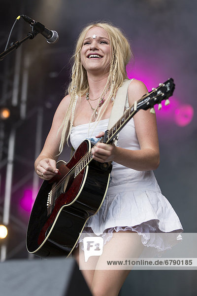 Solveig Heilo with a guitar from the Norwegian girl band Katzenjammer performing live at Heitere Open Air in Zofingen  Aargau  Switzerland  Europe
