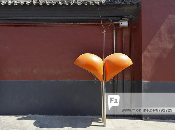Public telephone with a hood in retro design  Buddhist Lama Temple in the capital city of Beijing  China  Asia