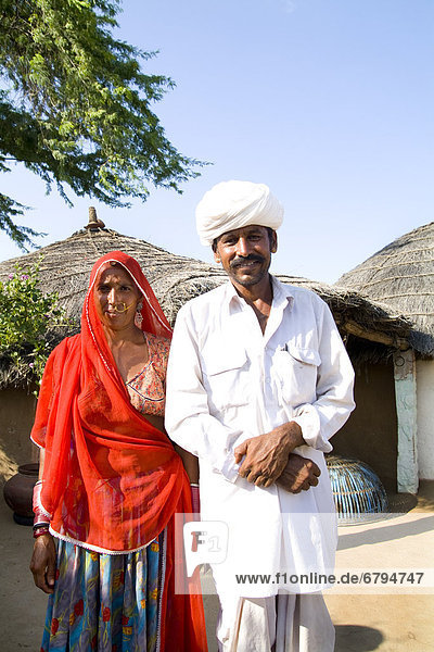 India  Rajasthan  Jodhpur  Indian couple in their poverty stricken village near the Great Indian Thar Desert.