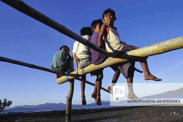 Boys Sitting On Wooden Structure  Conception  Panay  Philippines