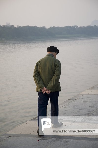 Man Walking Beside Li River  Guangxi Zhuang China