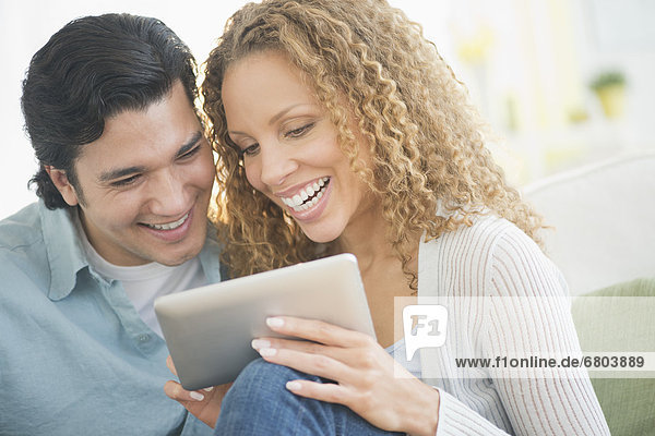 Couple looking at tablet pc