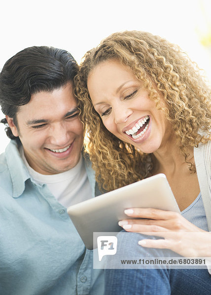 Couple looking at tablet pc