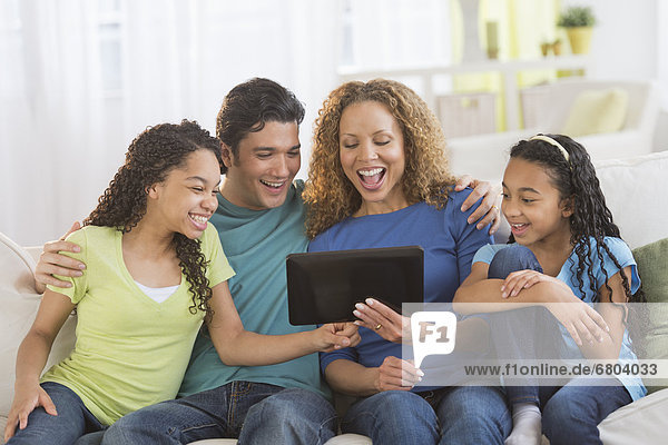 Parents with daughters (10-13) using tablet pc