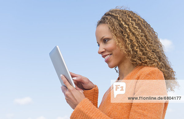 Mature woman using tablet pc