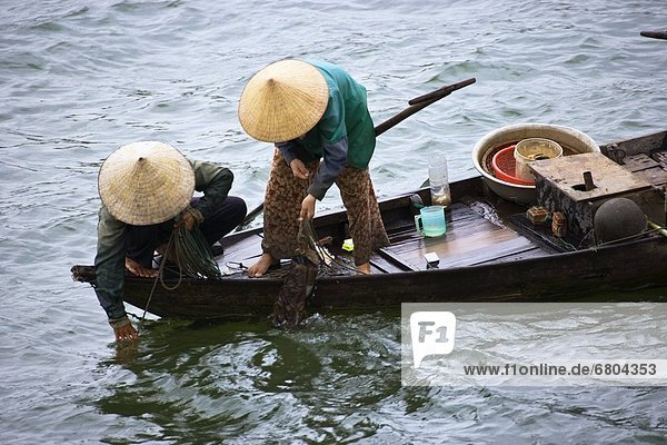 Women Fishing On A Small Boat In Vietnam  Hoi An Vietnam