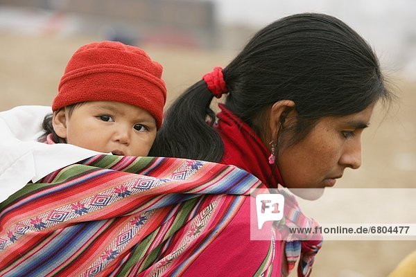 Mother With Child Slung On Back  Lima  Peru