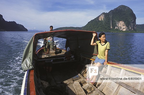 Locals Riding A Longboat  Trang Islands  Thailand