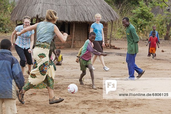 A Group Of People Kicking A Ball  Manica  Mozambique  Africa