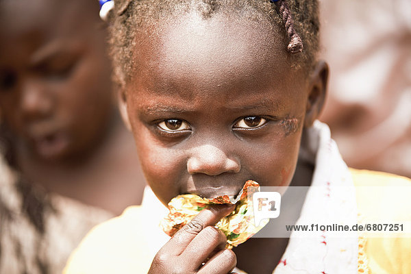 A Girl Eating  Kampala Uganda Africa